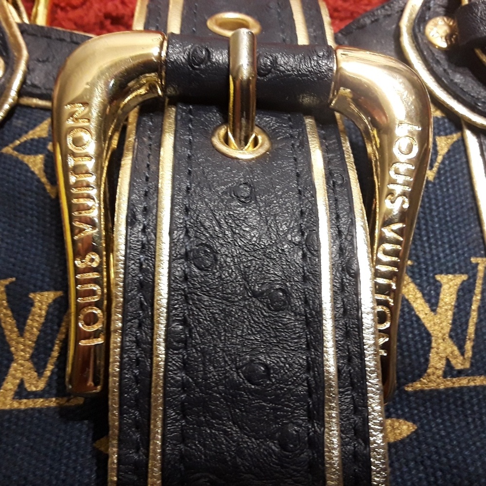 Louis Vuitton navy blue ostrich gold theda handbag